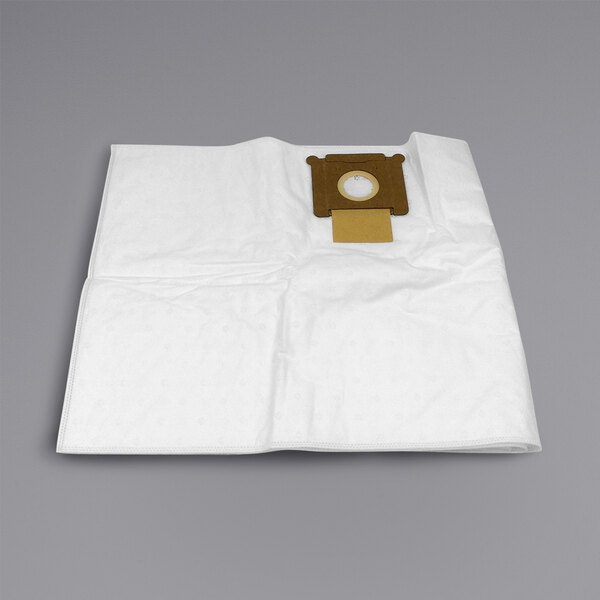 A white paper bag with a brown circle and square on it.
