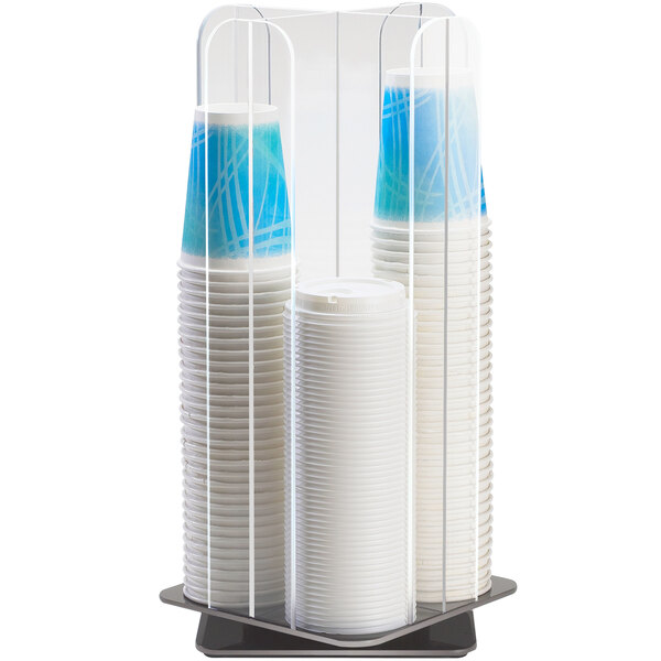 A clear acrylic cylinder with four sections holding cups and lids.