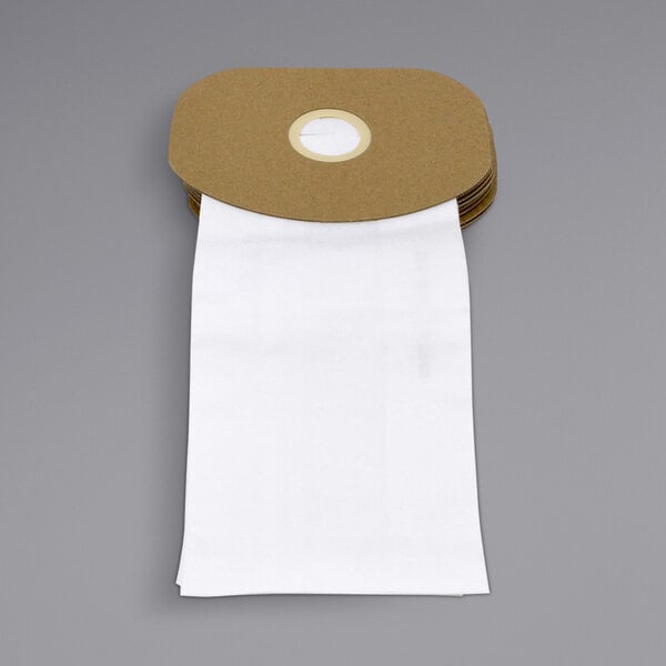 A stack of white paper bags with a circular hole in the middle.