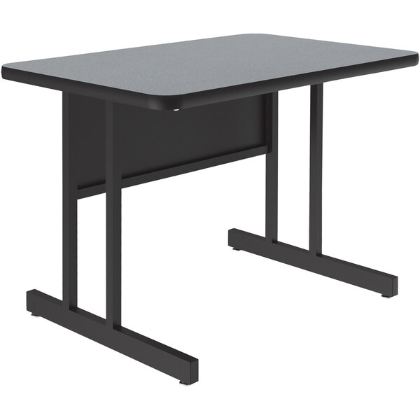 A rectangular grey granite Correll computer desk with black legs.
