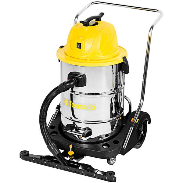 A Tornado stainless steel wet/dry vacuum with a yellow handle and black wheels.