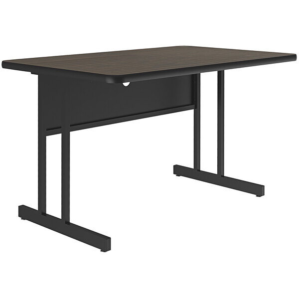 A black rectangular Correll computer desk with a walnut finish top and black legs.