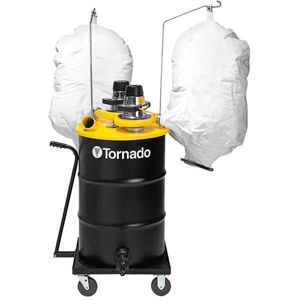 A black and yellow Tornado 55 gallon industrial vacuum with two white bags on it.