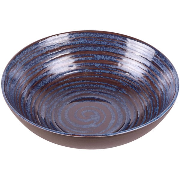 An Elite Global Solutions melamine bowl with a glossy and matte blue swirl pattern.