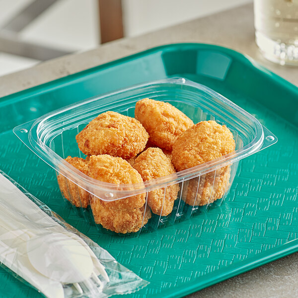 A World Centric rectangular clear plastic container filled with fried chicken nuggets.
