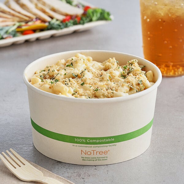 A World Centric compostable paper food bowl filled with macaroni and cheese.