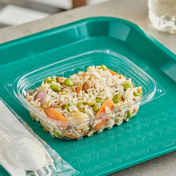 A plastic tray with a World Centric clear rectangular deli container of rice and vegetables.