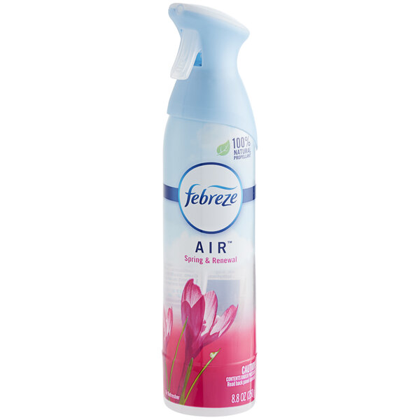 A bottle of Febreze Air Spring & Renewal scented air freshener with a white and blue spray cap decorated with pink flowers.