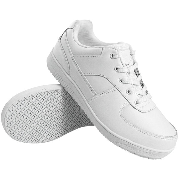 A pair of Genuine Grip white leather shoes with a non-slip sole.