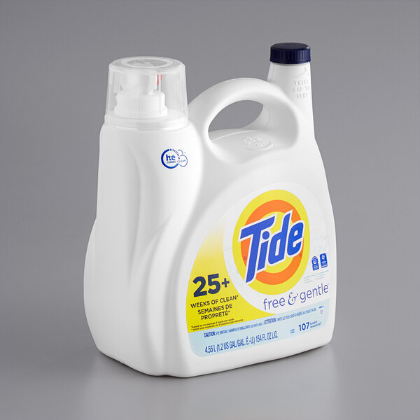 A white container of Tide Free & Gentle liquid laundry detergent with a yellow label.