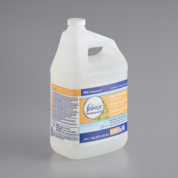 A white jug of Febreze Professional Fabric Refresher with blue and yellow labels.