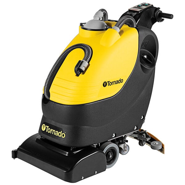 A yellow and black Tornado walk behind cylindrical floor scrubber with a black handle and wheels.