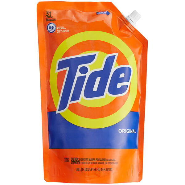 A close up of a blue and orange Tide Original laundry detergent pouch.