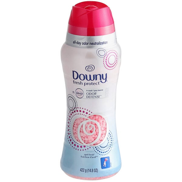 A white container of Downy April Fresh Scent Booster Beads with pink and blue labels.
