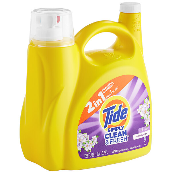 A yellow Tide container of Simply Clean & Fresh Berry Blossom Liquid Laundry Detergent with a white cap.