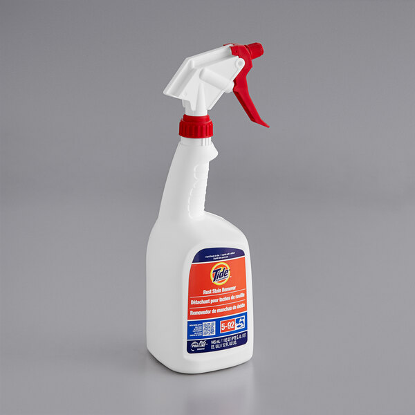 A white bottle of Tide Professional Rust Stain Remover with a red and blue label and a white lid.
