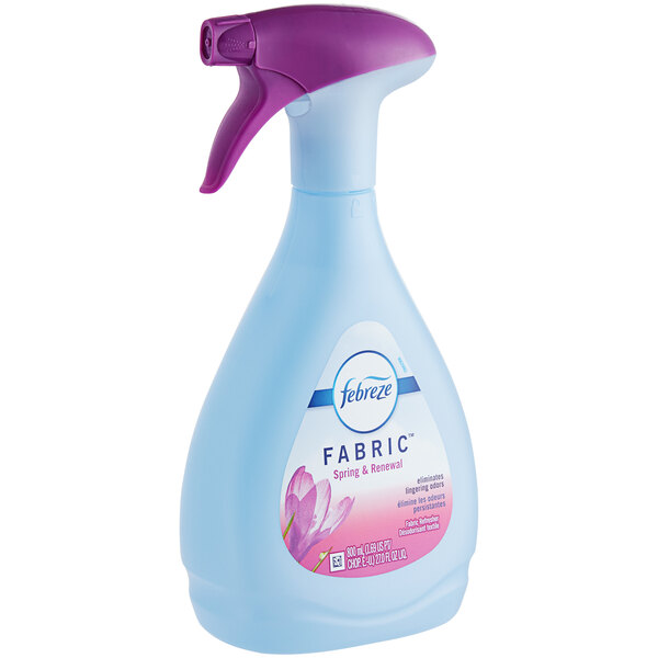 A bottle of Febreze Fabric Spring & Renewal Scent Fabric Refresher with a purple spray nozzle.