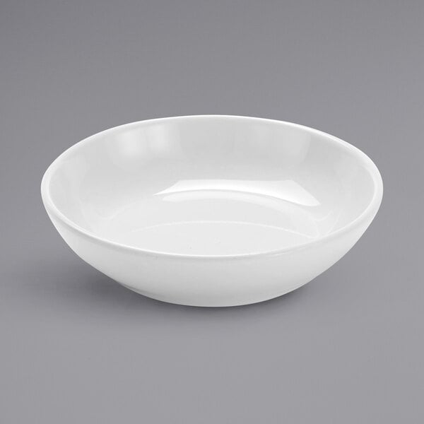 An American Metalcraft white mini melamine bowl on a white surface.