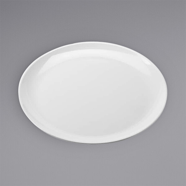 An American Metalcraft white melamine pizza plate with a white rim on a gray surface.