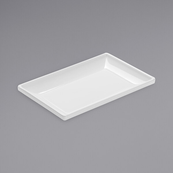 A white rectangular American Metalcraft mini melamine plate on a gray surface.