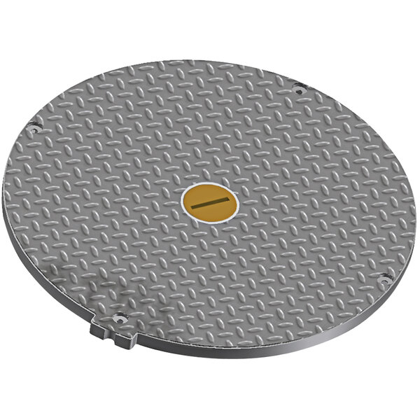 A round metal cover with a yellow circle and a black line on it.