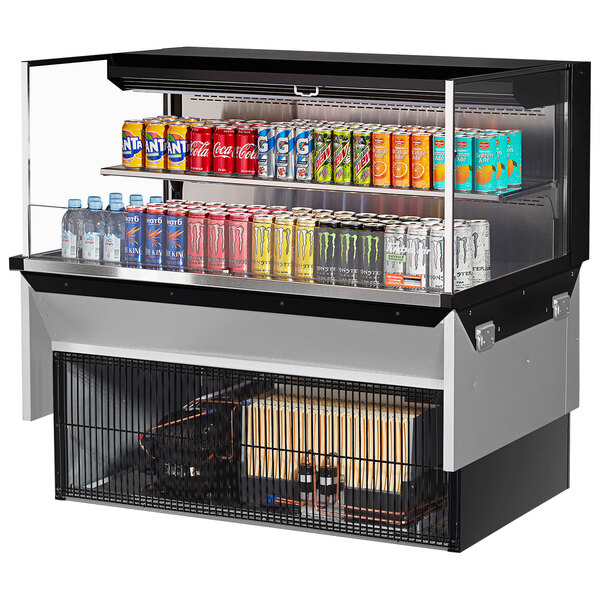 A Turbo Air drop-in refrigerated display case filled with a variety of canned drinks.