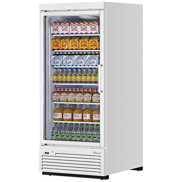 A white Turbo Air refrigerated glass door merchandiser full of drinks on shelves.