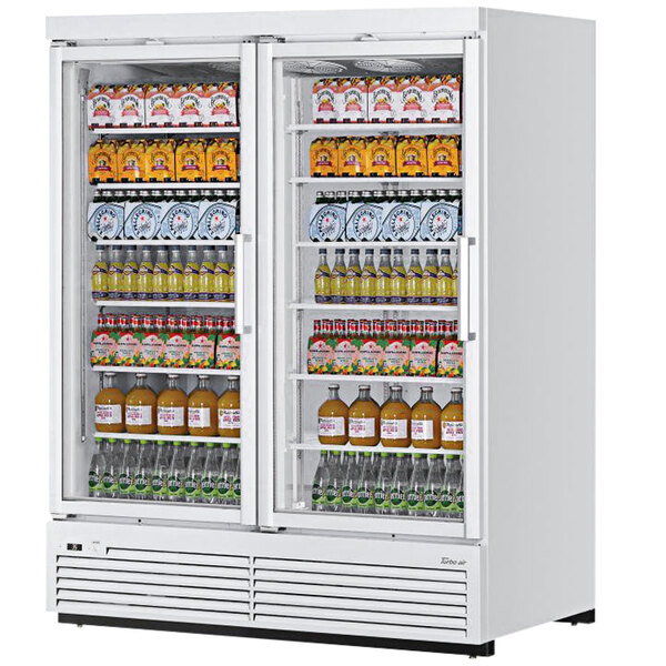 A white Turbo Air refrigerated glass door merchandiser with drinks on shelves.