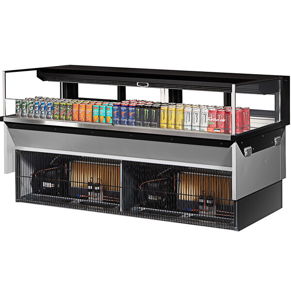 A Turbo Air black drop-in refrigerated display case with several energy drinks inside.