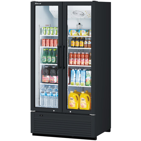 A black Turbo Air refrigerated glass door merchandiser with drinks and beverages on shelves.