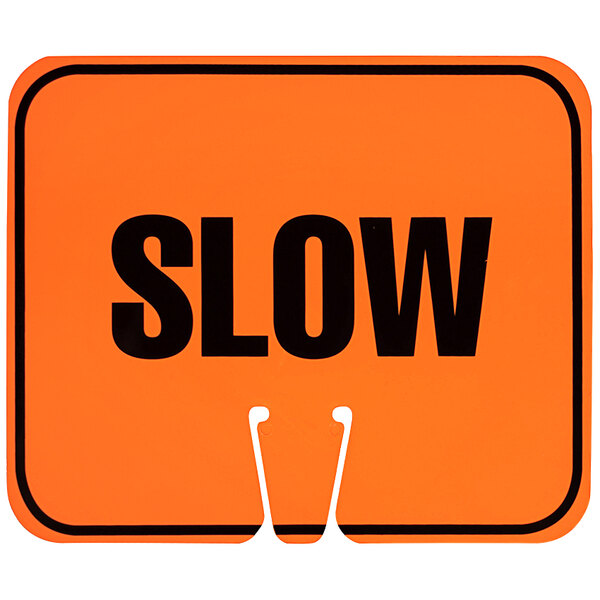 A close up of a Cortina orange and black "Slow" sign.