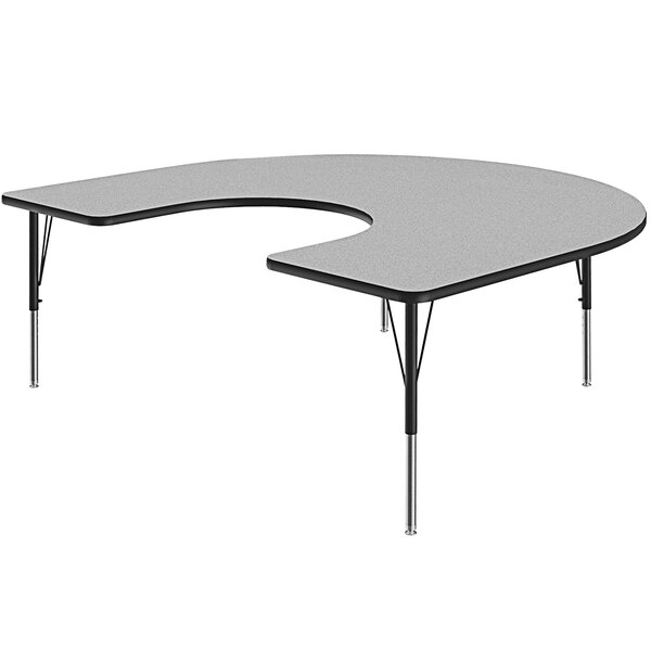 A grey Correll horseshoe-shaped activity table with a black base.
