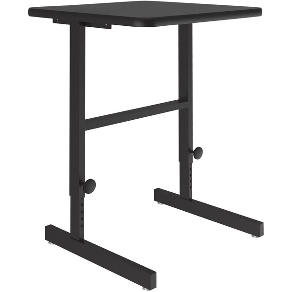 A Correll black granite standing height work station with a metal base.