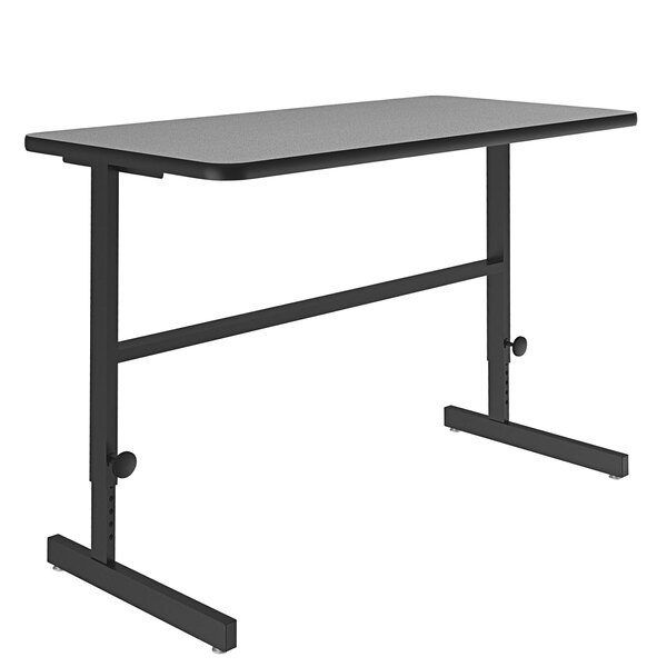 A Correll gray granite rectangular desk with black metal legs.