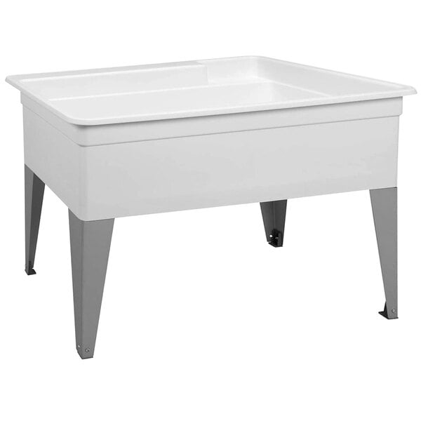 A white sink with metal legs.