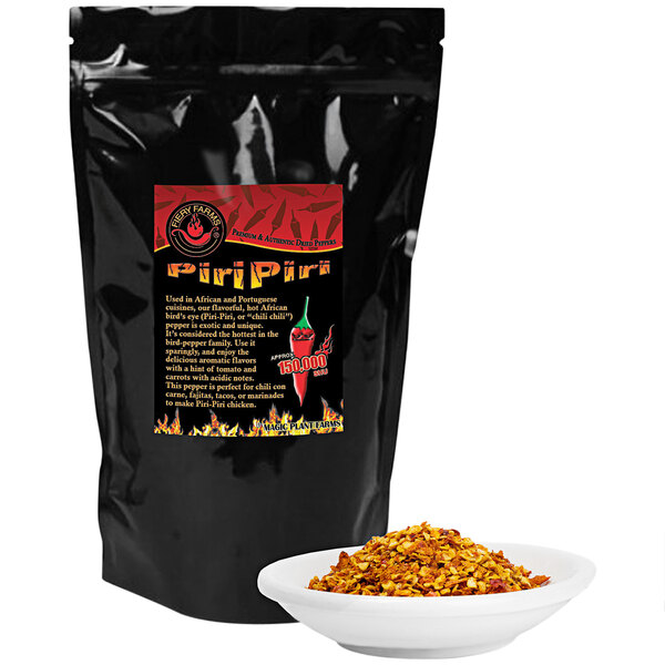 A black bag of Fiery Farms Red African Bird's Eye Pepper Flakes with a bowl of pepper flakes.