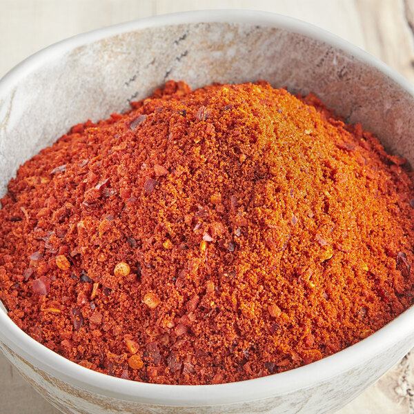A bowl of McCormick Culinary Sriracha seasoning, a red powder.