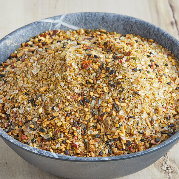 A bowl of McCormick Culinary Asian Spiced Sea Salt on a table.