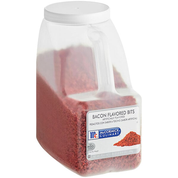 A plastic container of McCormick Culinary Bacon Flavored Bits with a white lid.
