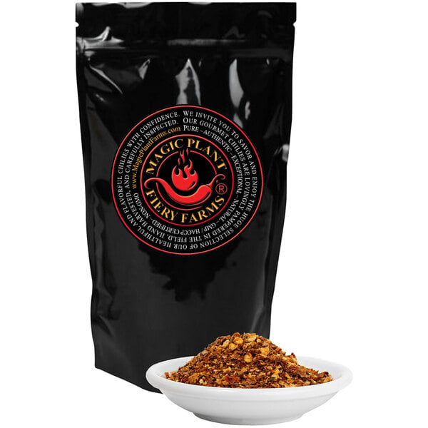 A black bag of Fiery Farms Red Devil's Breath Pepper Flakes with a white bowl of food.