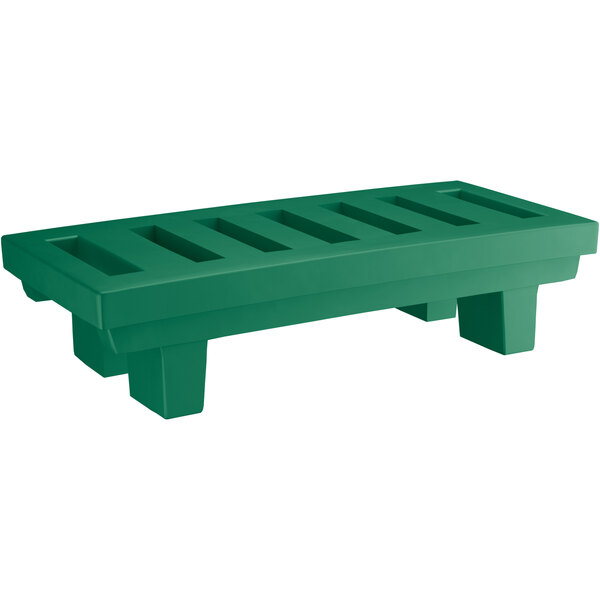 A green plastic bench with slotted top.