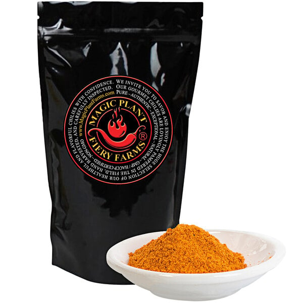 A black bag of Fiery Farms red sriracha pepper powder with a bowl of orange powder.