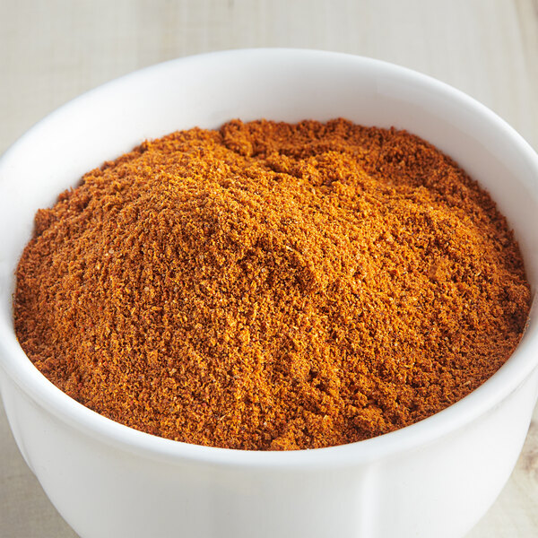 A bowl of McCormick Culinary Barbecue Spice powder.