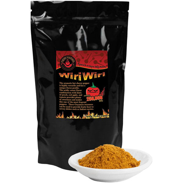 A black bag of Fiery Farms Red Hot Cherry Bomb Pepper Powder with a bowl of yellow powder.