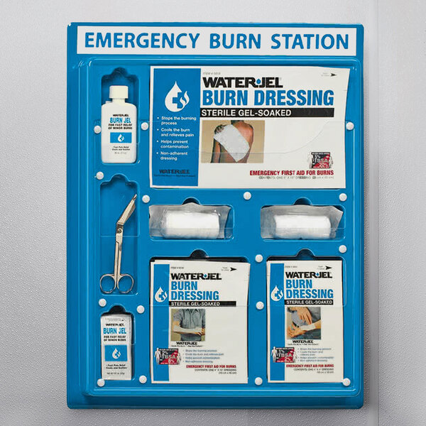 A blue Medi-First emergency burn station box with medical items inside.