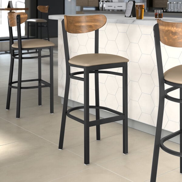 Lancaster Table & Seating Boomerang Series Black Finish Bar Stool with Taupe Vinyl Seat and Vintage Wood Back