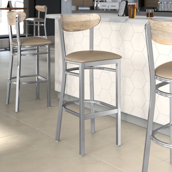Lancaster Table & Seating bar stools with driftwood backs and taupe seats.