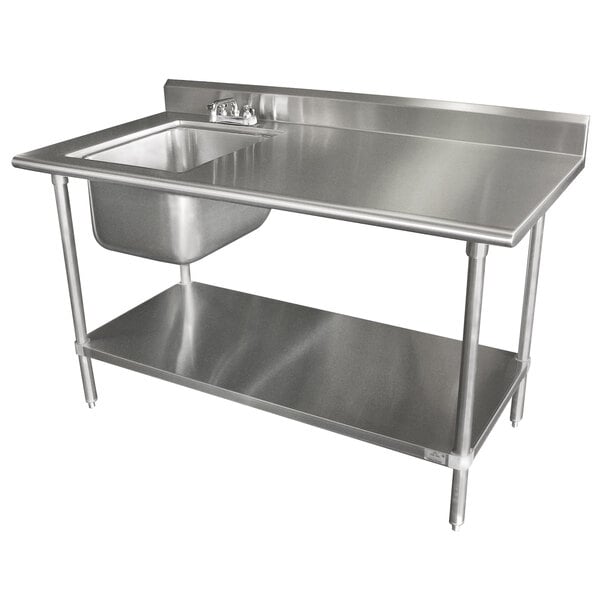 A stainless steel work table with a sink on the left and a shelf.