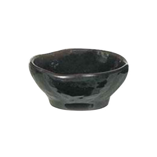 A black bowl with a wave design on the rim.