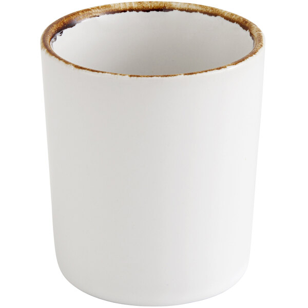 A Fortessa bright white ceramic cup with a brown rim.